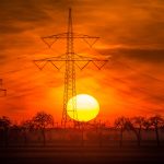 sunset-over-electricity-towers-and-red-sky